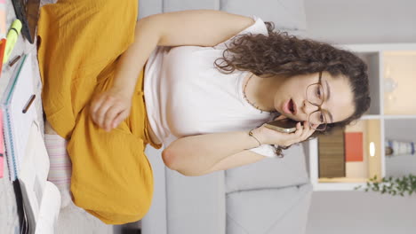 Vertical-video-of-Female-student-receiving-bad-news-on-the-phone.